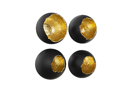 angled view of the Broken Egg Black Wall Art Set by Phillips Collection four decorative wall sculptures in gold leaf and black finishes